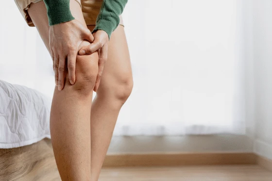 Person experiencing knee discomfort